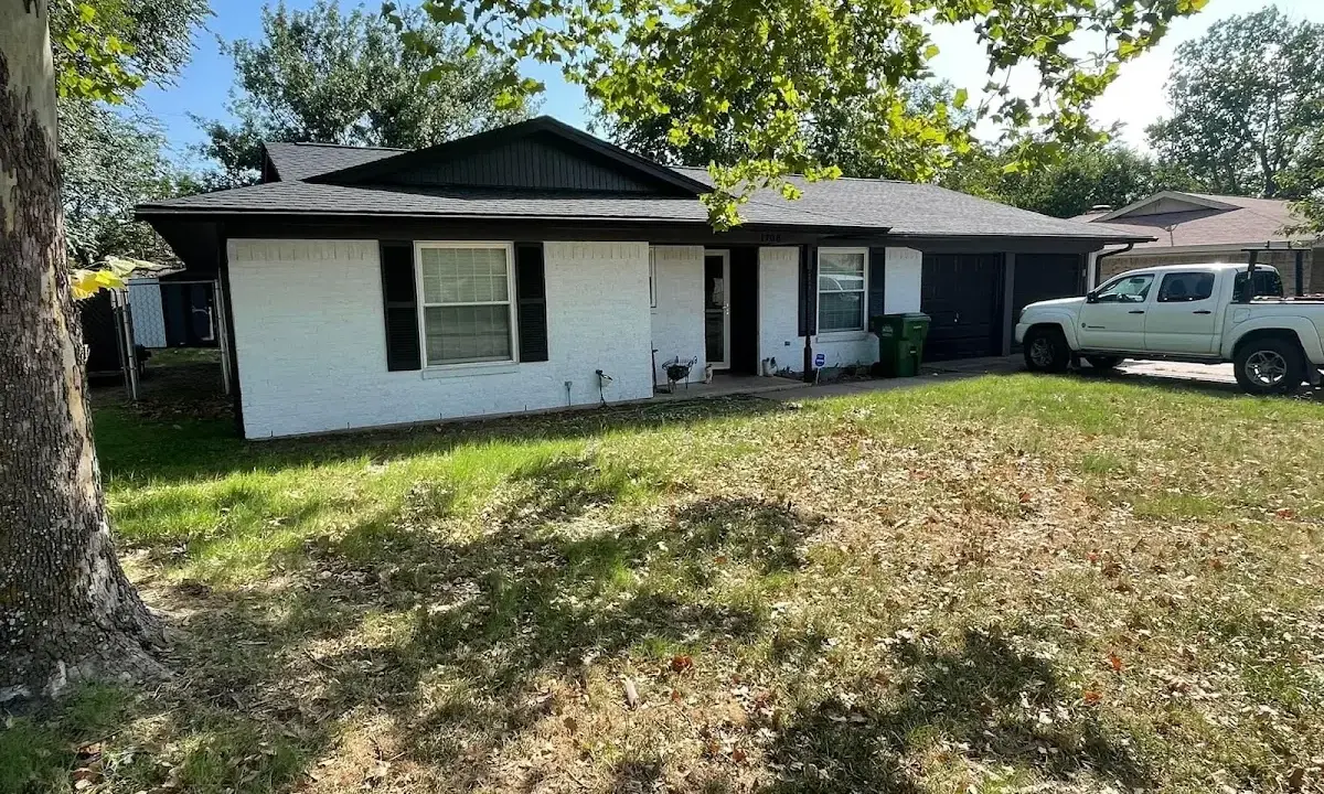 Professional roofing crew working on a residential roof in Harborcreek
